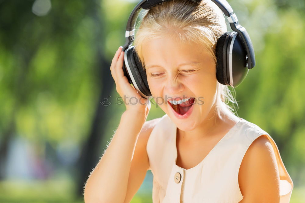 Similar – Image, Stock Photo Little girl with headphones outside