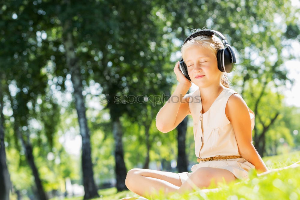 Similar – Image, Stock Photo Little girl with headphones outside