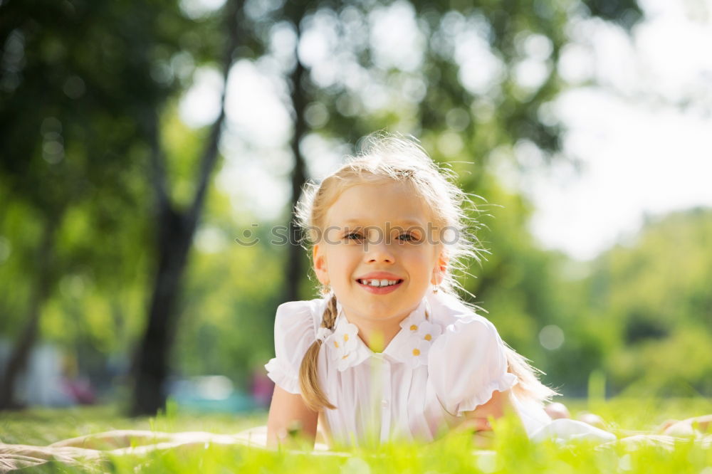 Similar – happy kid girl hiding under umbrella