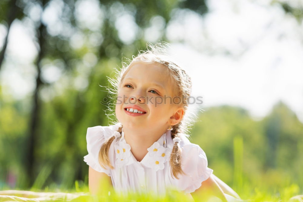 Similar – Cute black boy having fun on a swing in his parents garden