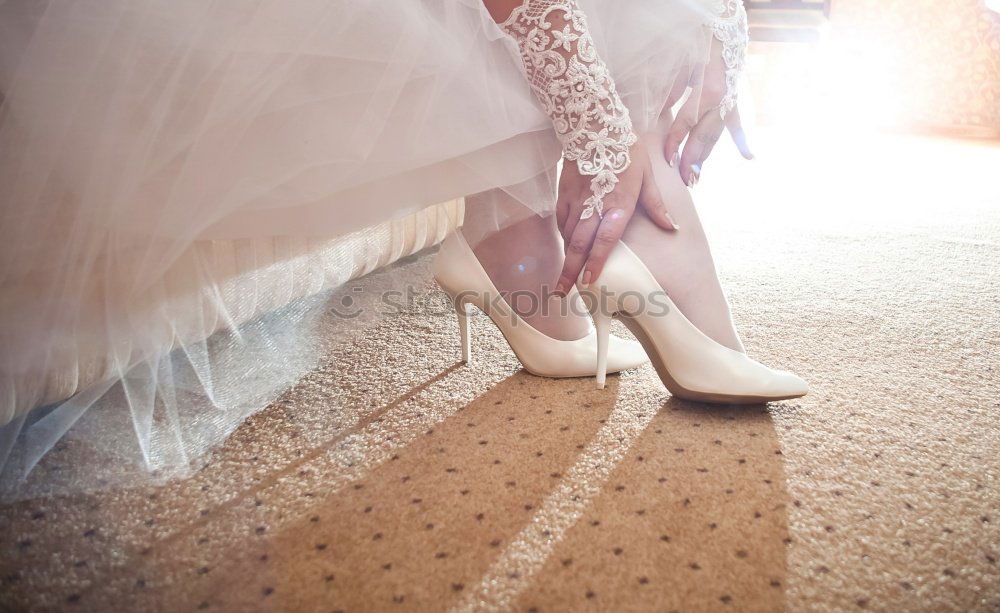 Similar – Image, Stock Photo Crop bride putting on shoes