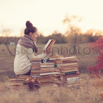 Similar – pretty young woman reading a book