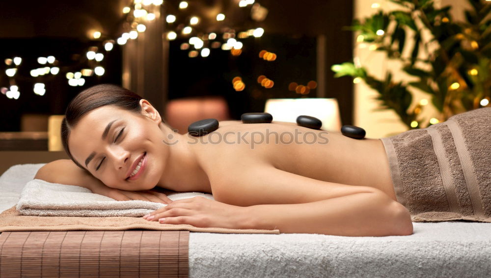 Woman lying in tub doing hydrotherapy treatment