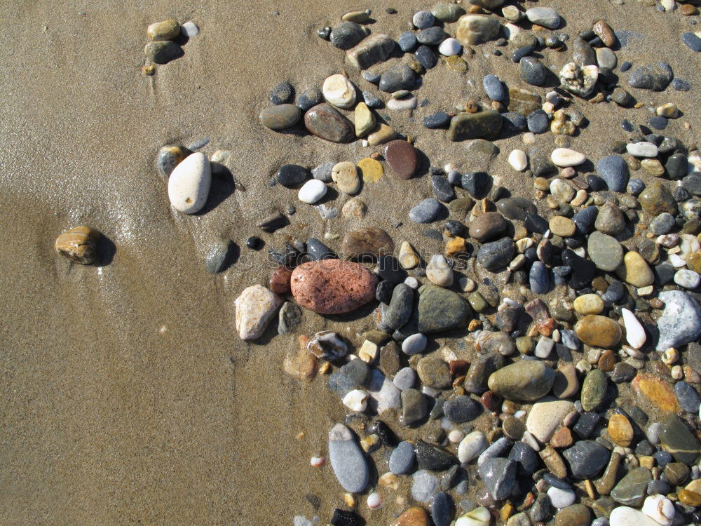 Similar – Pebble with a cross