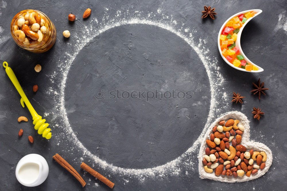 Image, Stock Photo Green olives and salt in wooden bowls, top view