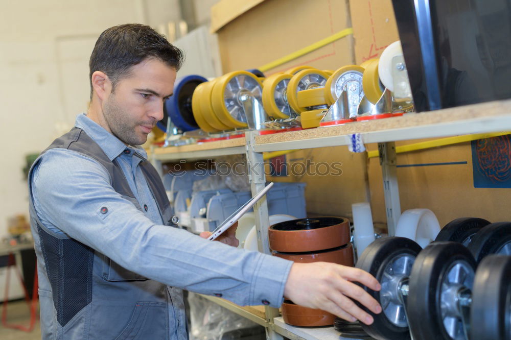 Similar – Professional Mechanic Repairing Car.