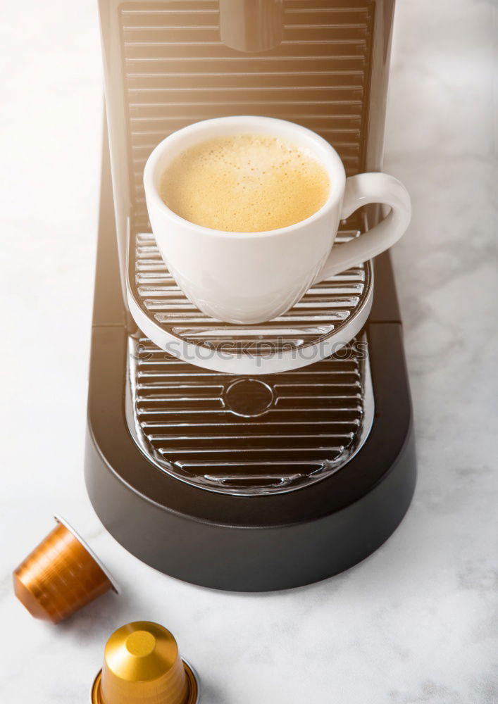 Similar – Glass coffeepot, white porcelain filter, light brown filter paper and dark brown continuous bubble forming coffee, apple, egg in wooden egg cup, white cup, corn waffles, white table in front of grey wall in the morning light.