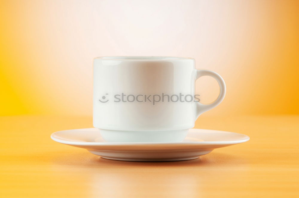 Similar – Image, Stock Photo Coffee cup and saucer with gold decoration stand on a wooden table