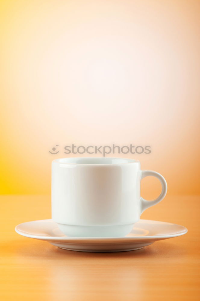 Similar – Image, Stock Photo Coffee cup and saucer with gold decoration stand on a wooden table