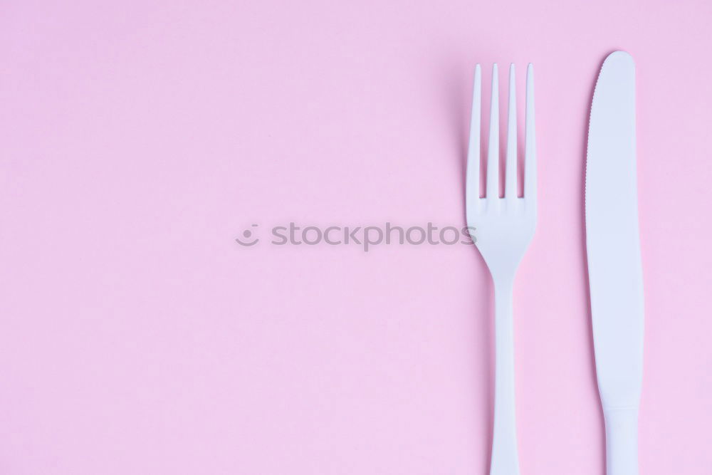 Similar – Disposable colorful plastic dish, straws and cups, cutlery. Flat lay on pink background.