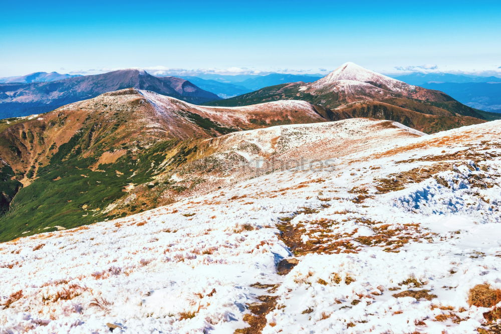 Similar – White peaks of mountains in snow