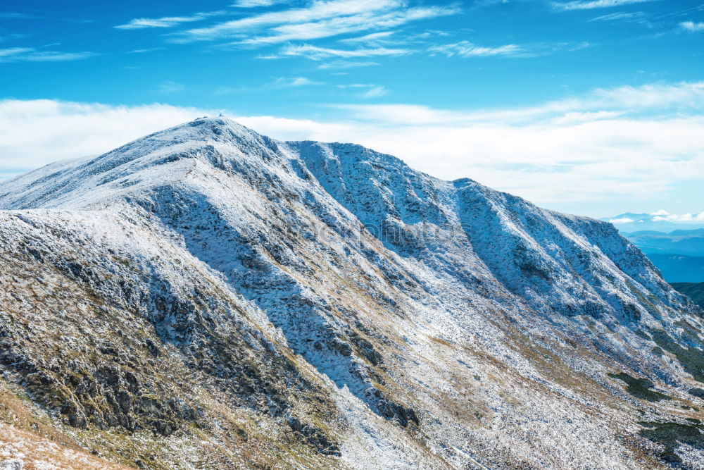 Similar – White peaks of mountains in snow