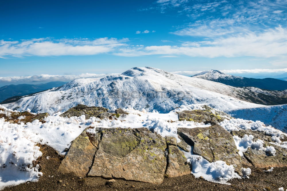 Similar – White peaks of mountains in snow