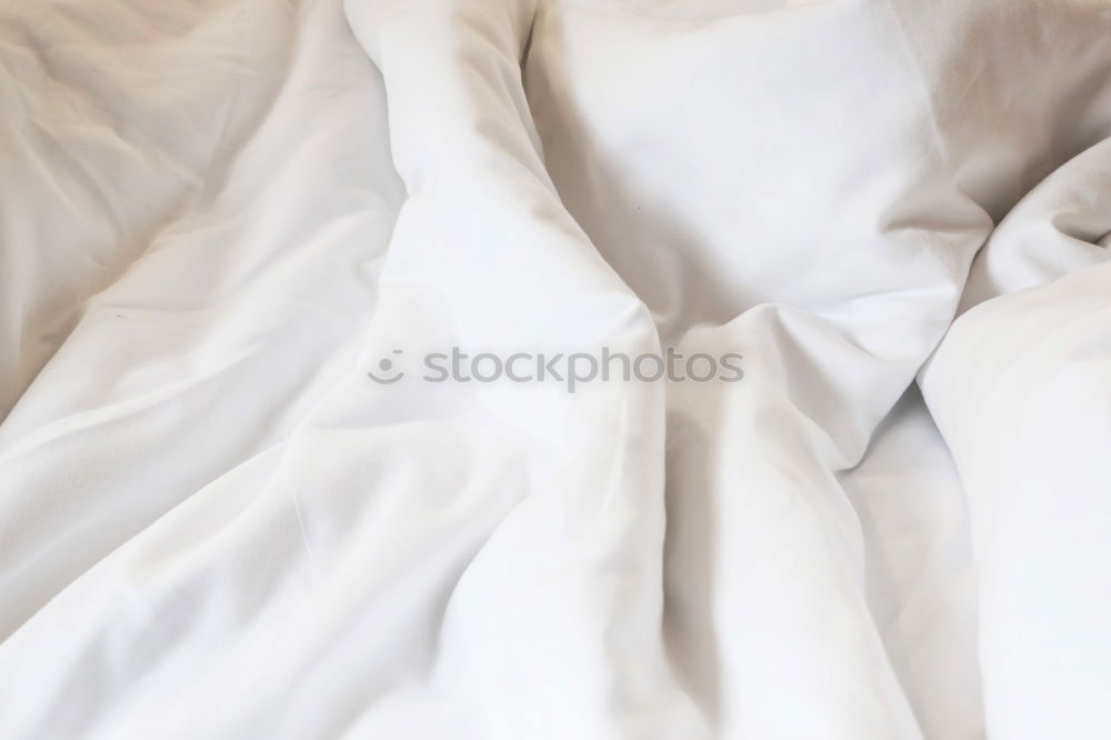 Similar – Image, Stock Photo A bed with two feet coming out of the sheets