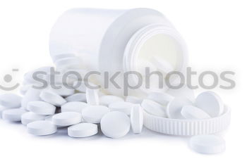 Similar – pill bottle,blister with white tablets,painkillers and a glass of water.Concept of medicine