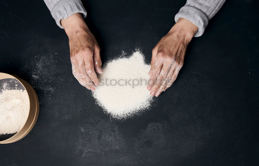 Similar – Image, Stock Photo white wheat flour in male hands, black background