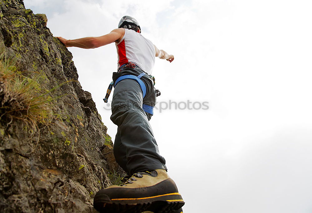 Similar – Climber reaching for a helping-hand.