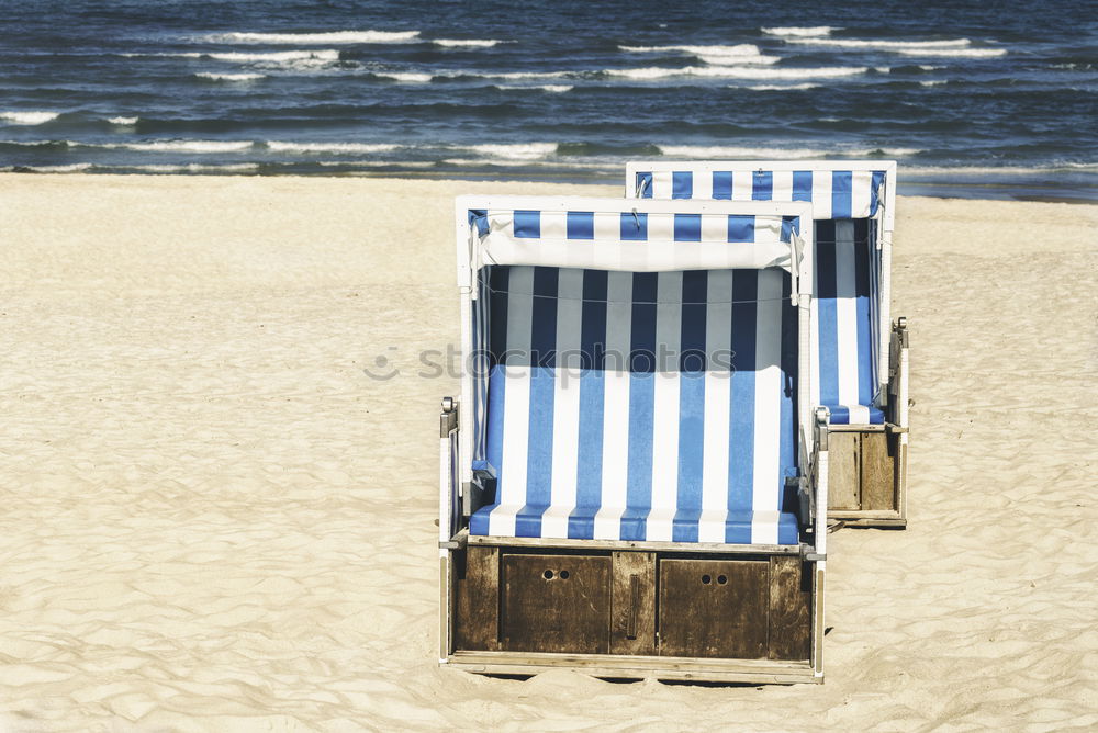 Similar – Strandkörbe auf dem Sand an der Nordsee auf der Insel Sylt. Sommerurlaub