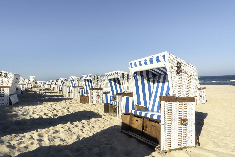 Similar – Strandkörbe auf dem Sand an der Nordsee auf der Insel Sylt. Sommerurlaub