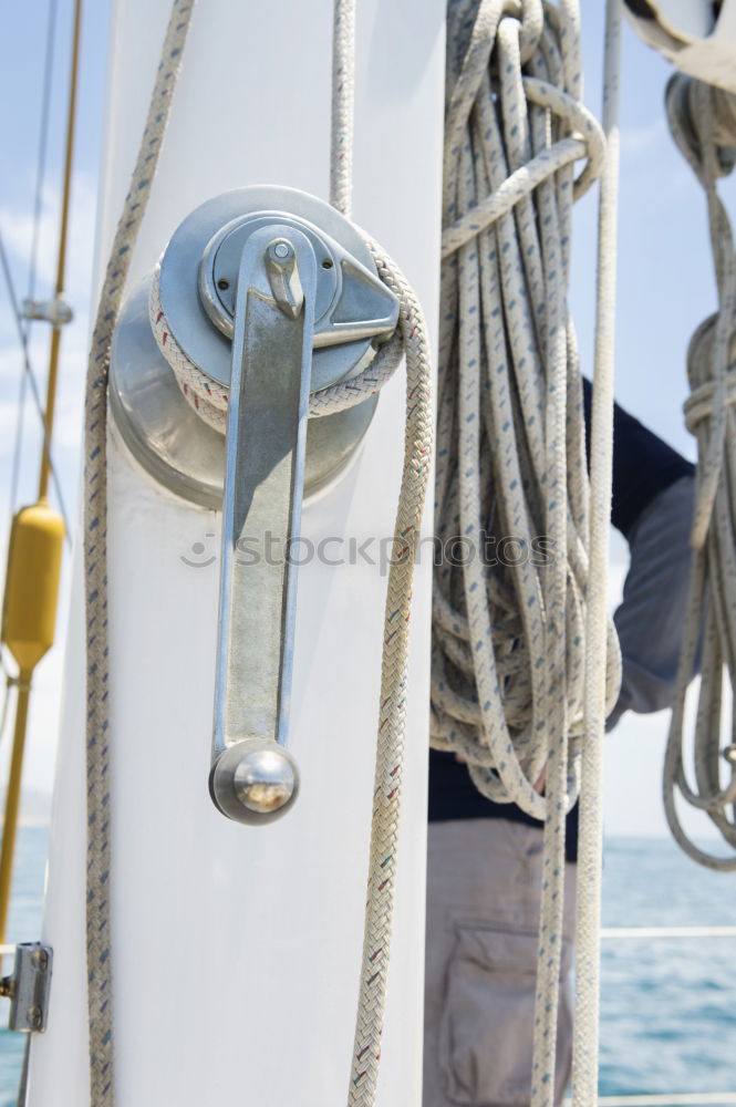 Fenders suspended between a boat and dockside for protection. Maritime fenders