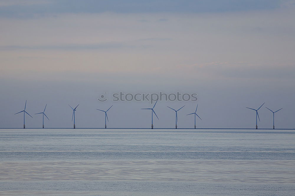 Similar – Image, Stock Photo Wind power plants in the morning haze