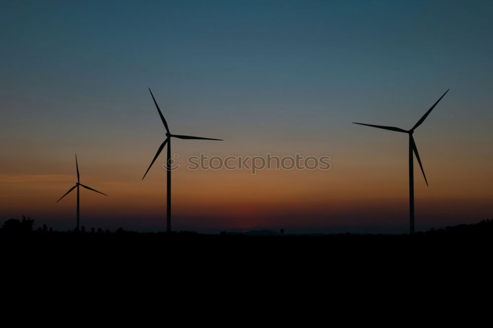 Similar – Windmills at sunset