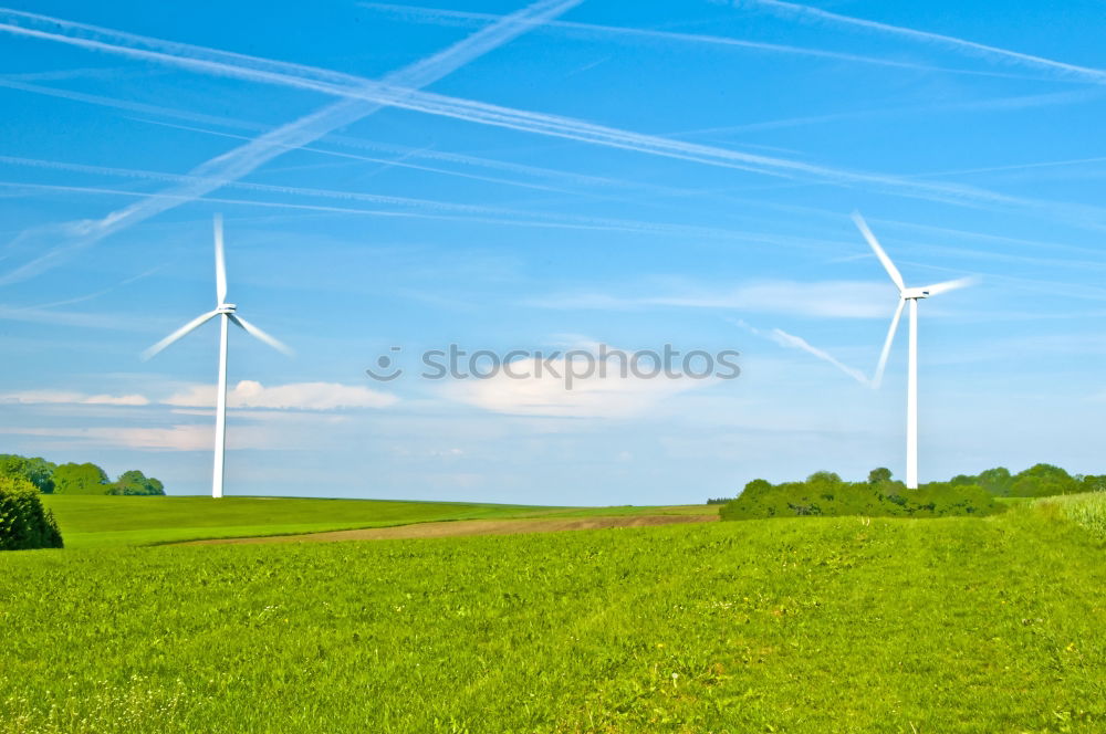 Similar – Image, Stock Photo Wind turbine for renewable power generation in front of a dike on the North Sea coast, long straight road. Wind turbine