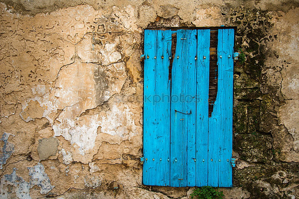 Similar – Small stool with blanket, standing in front of blue door, in the medina.