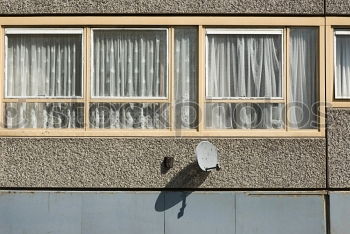 facade with rounding, plaster and brick