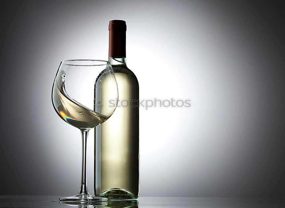 Similar – Red wine bottle and red wine glass with grapes