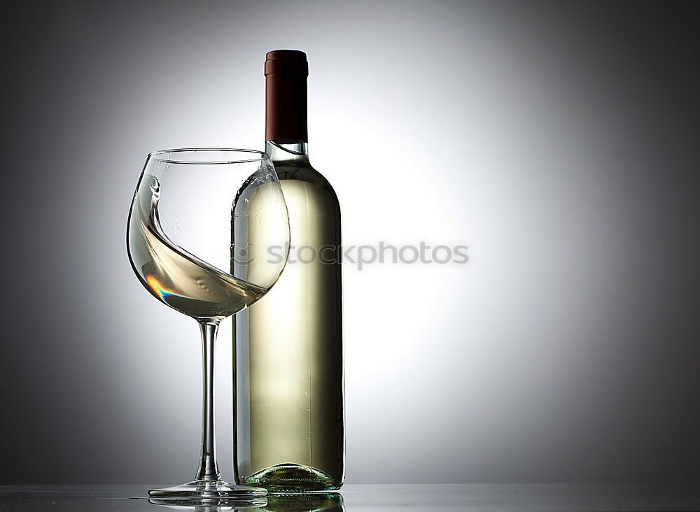 Similar – Red wine bottle and red wine glass with grapes