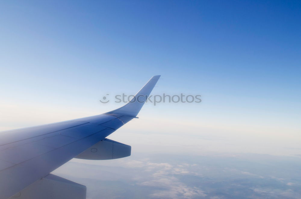 Similar – Foto Bild über den Wolken Flugzeug