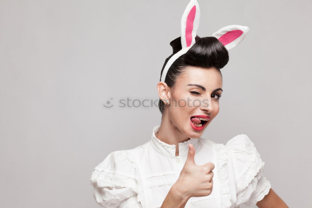 Similar – Back view of a young woman wearing rabbit ears