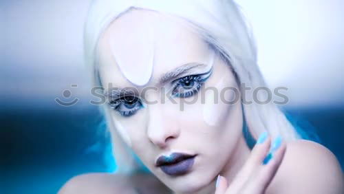 Similar – Young alternative woman is eating a cotton candy