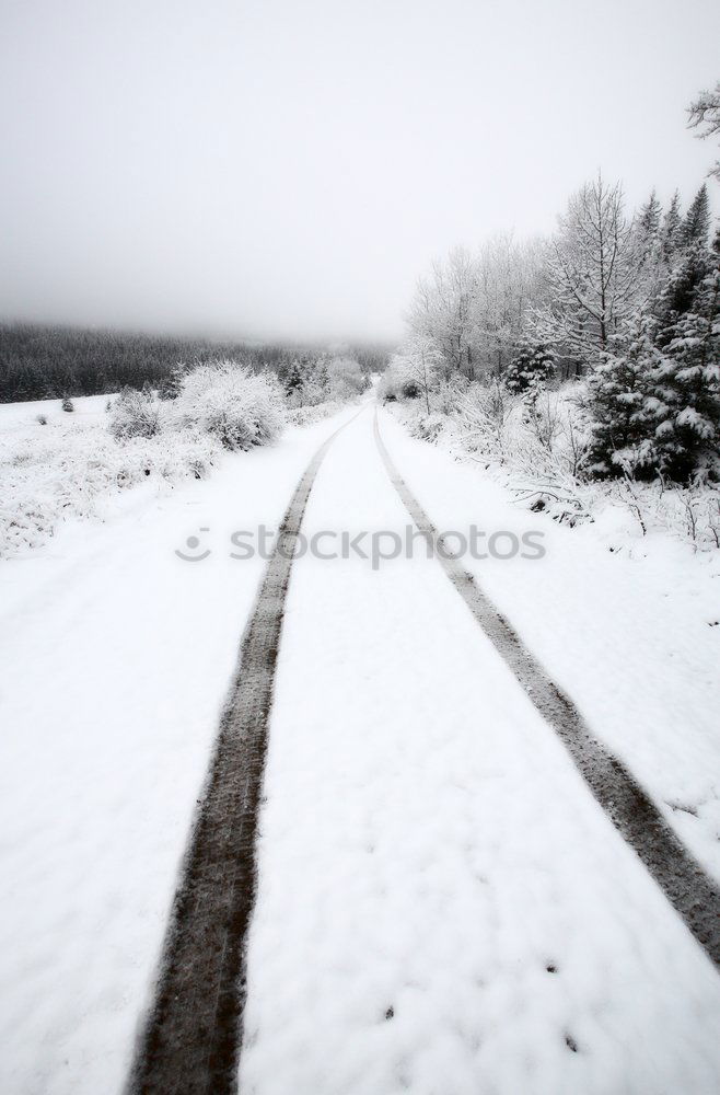 Similar – Snowy rural road at winter