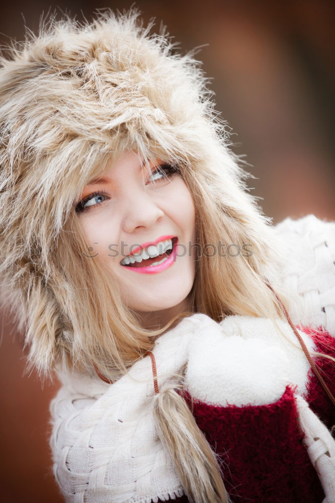 Similar – young woman 30 years in snow with red coat and leopard dress blond hair curly happy hopeful street