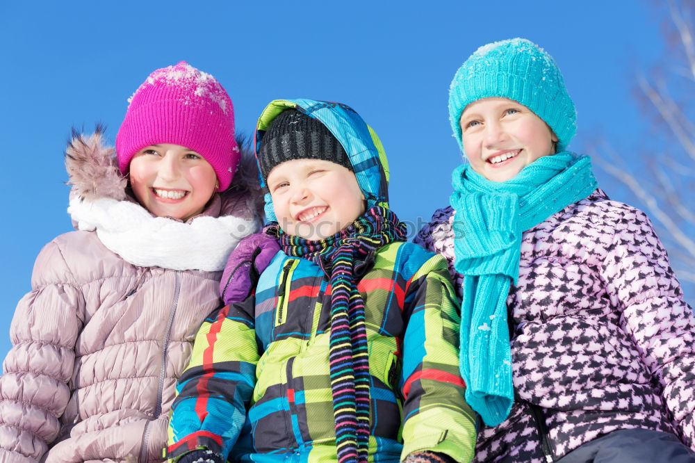 Similar – Cute little children playing in snow at a winter day. People having fun outdoors. Concept of Happy new year.