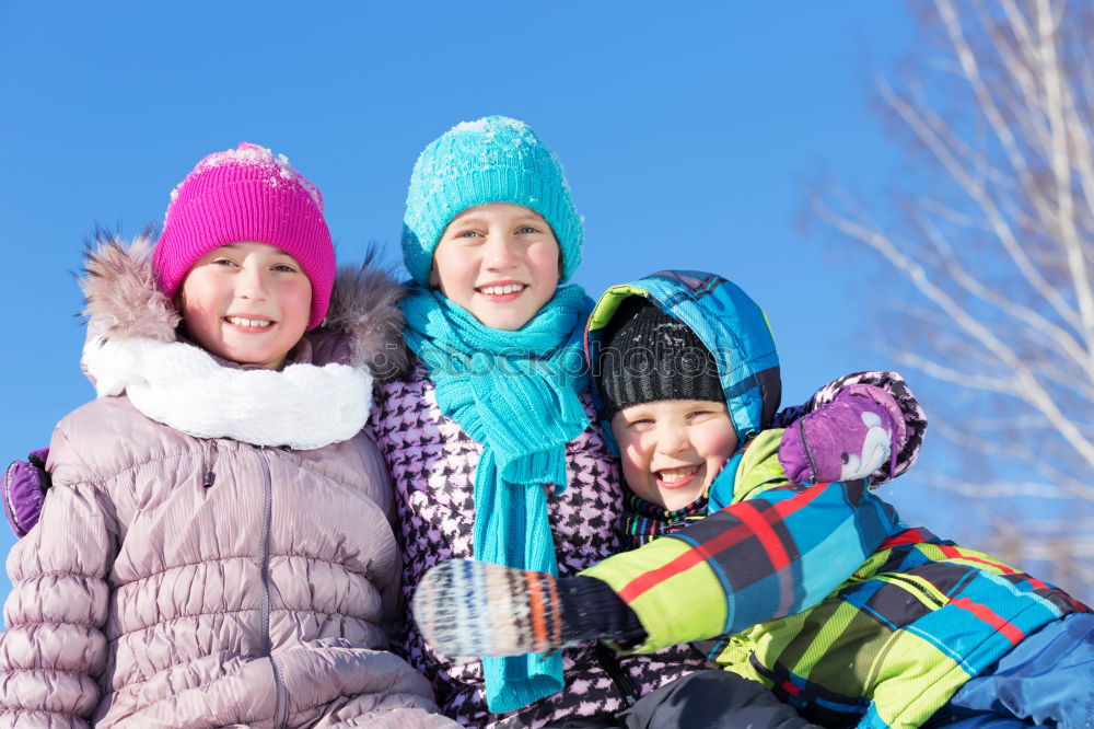 Similar – Cute little children playing in snow at a winter day. People having fun outdoors. Concept of Happy new year.