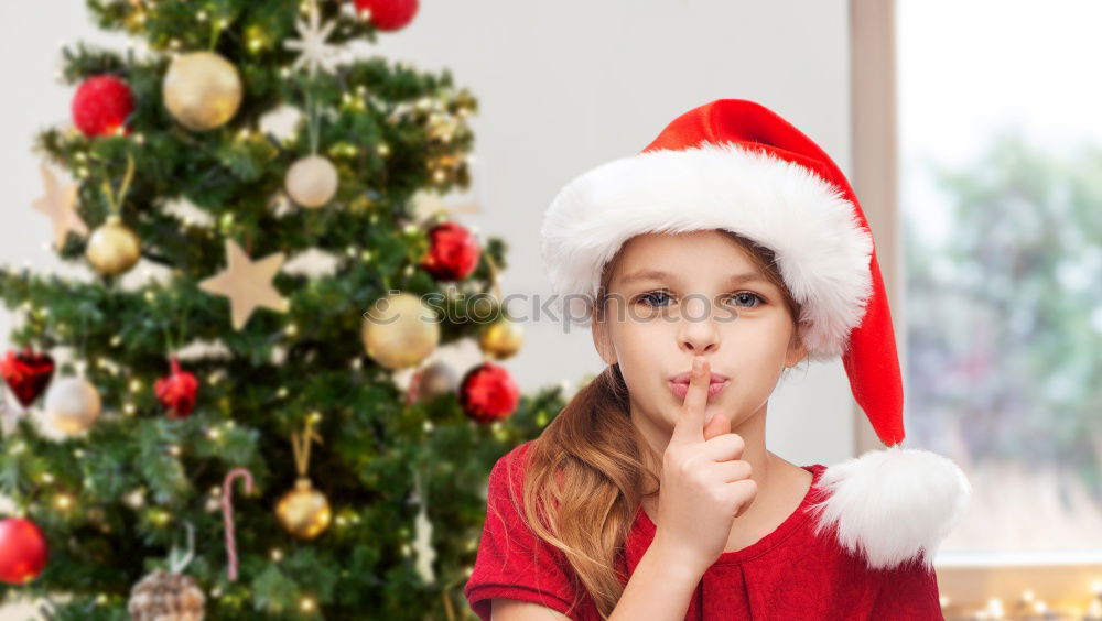 Similar – Adorable kid with Santa´s hat on Christmas day.