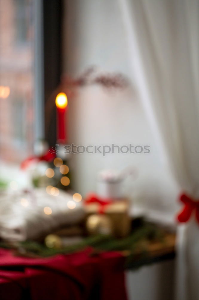 Christmas table set with biscuits and candles