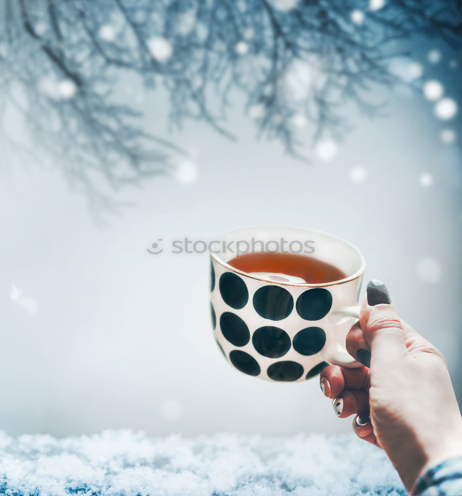 Similar – Young woman holding warm cup of tea