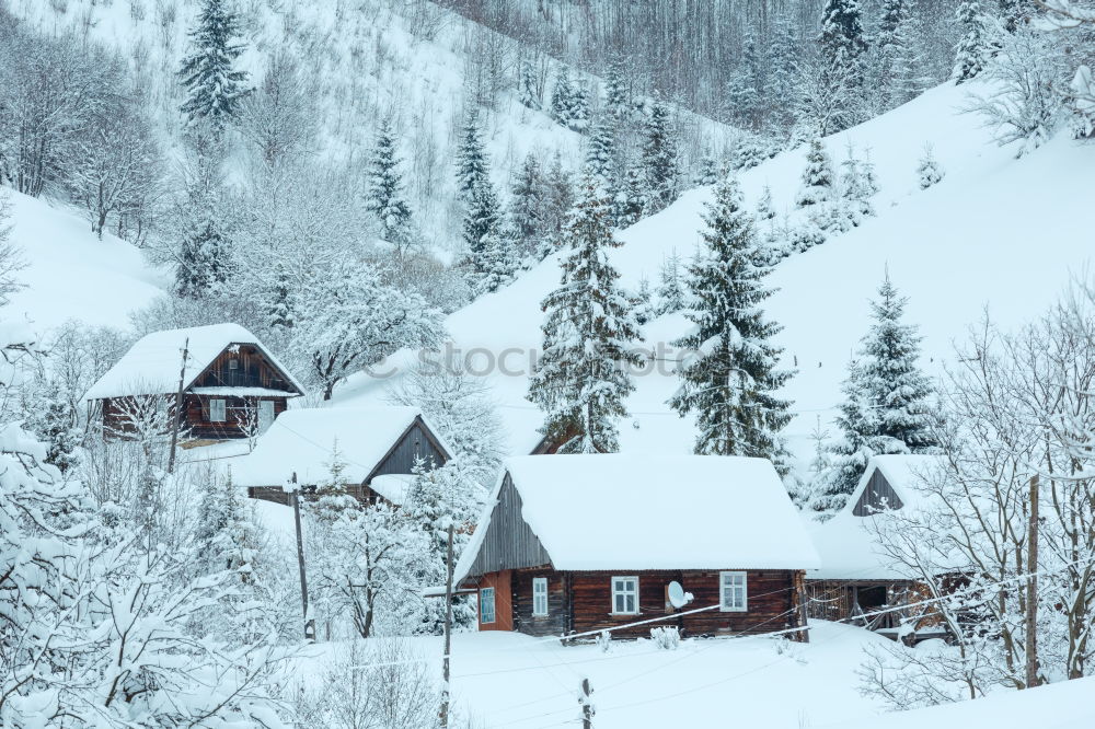 Snowfall over Austrian mountain village