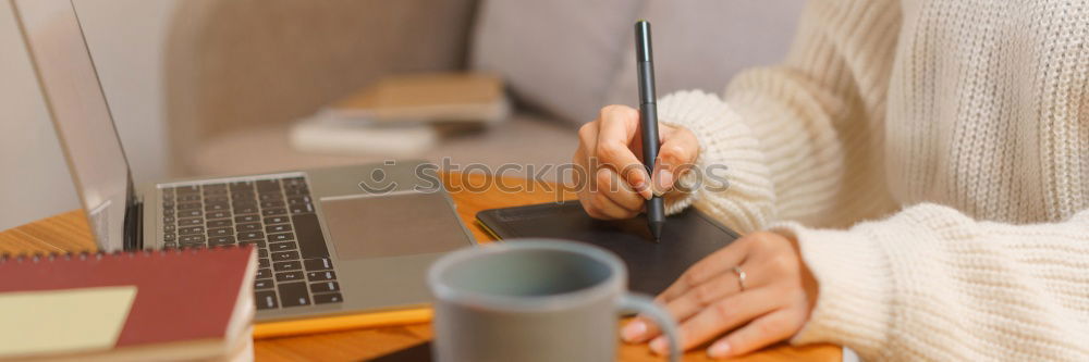 Similar – Woman measuring her own blood pressure at home.