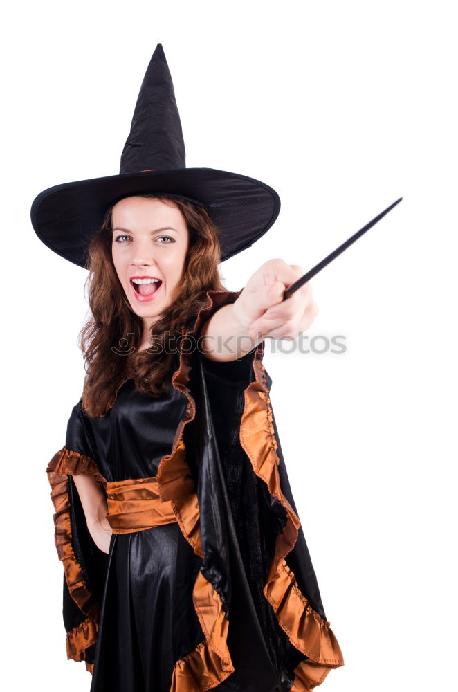 Similar – Beautiful girl disguised of witch decorating a pumpkin at home.