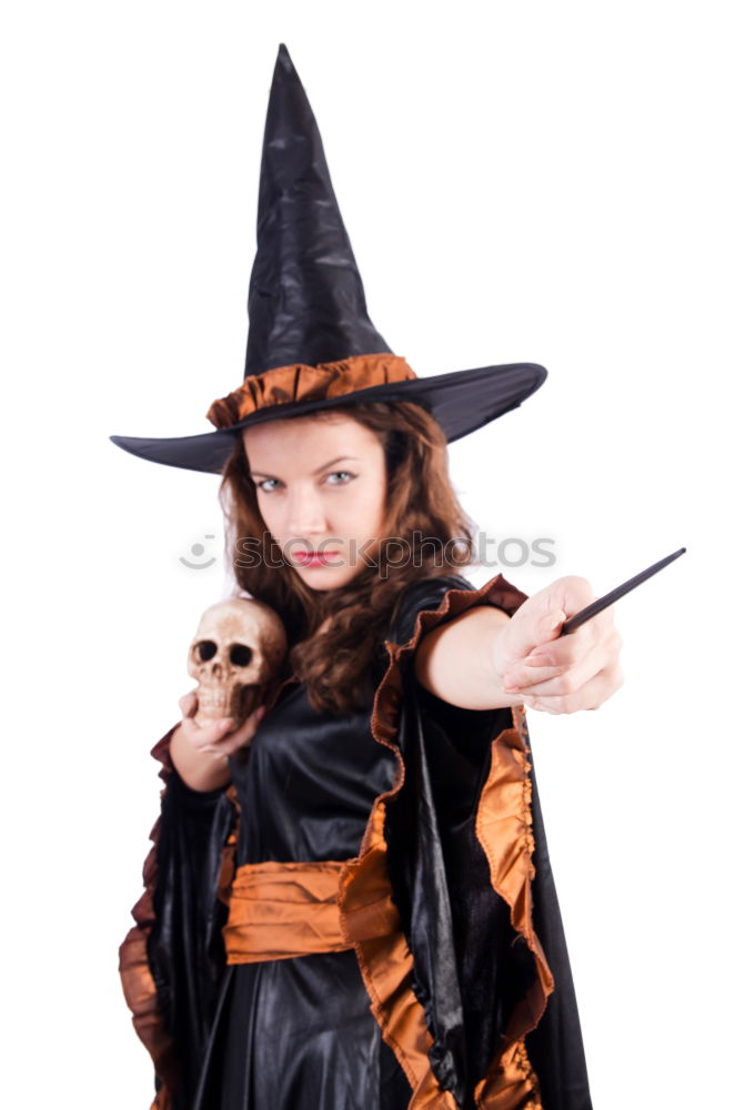 Similar – Beautiful girl disguised of witch decorating a pumpkin at home.