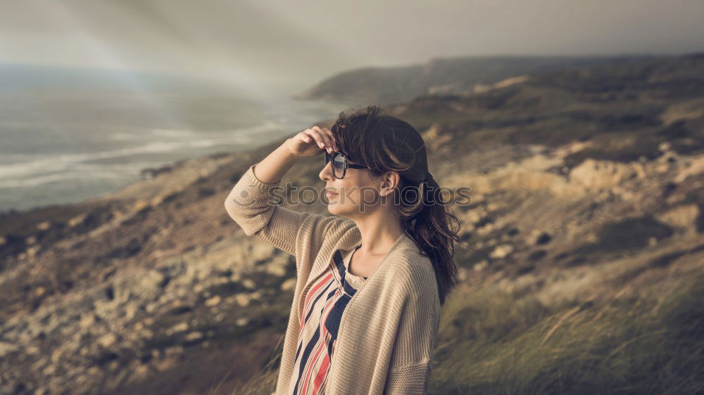 Similar – Image, Stock Photo Legs of man sitting at cliff