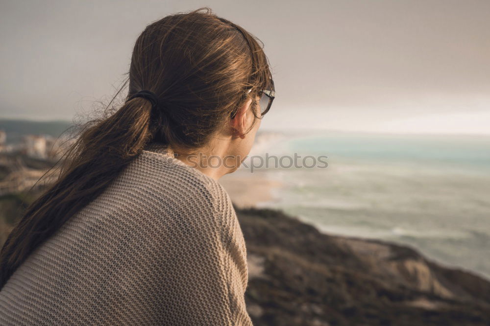 Similar – Image, Stock Photo Young woman is taking picture of sunset at the beach