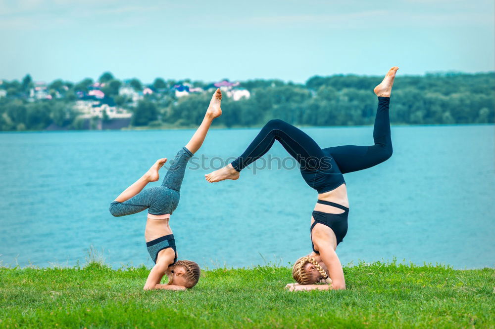 Similar – Image, Stock Photo Two young gymnast girls showing their flexibilty and stretching posing outdoor on a summer day