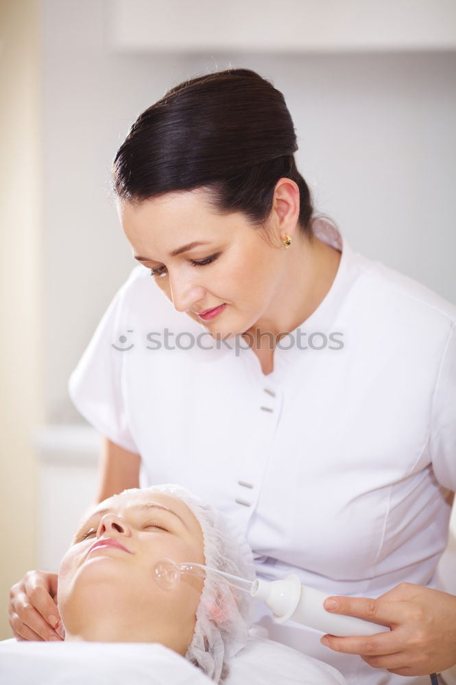 Similar – Professional cosmetician applying a facial mask with cosmetic brush