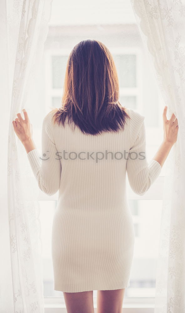 Similar – Image, Stock Photo young redhead woman with curls and freckles stands barefoot in hot pants in front of white door and smiles